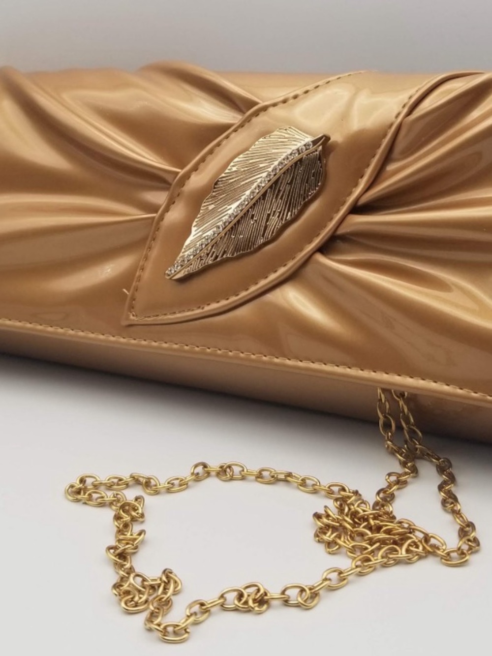 Elegant Tan Satin-Effect Clutch with Gold Feather Accent